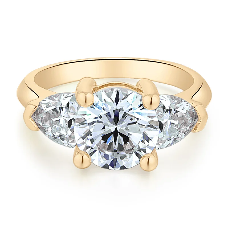 Three stone ring with 4.15 carats* of diamond simulants in 10 carat yellow gold