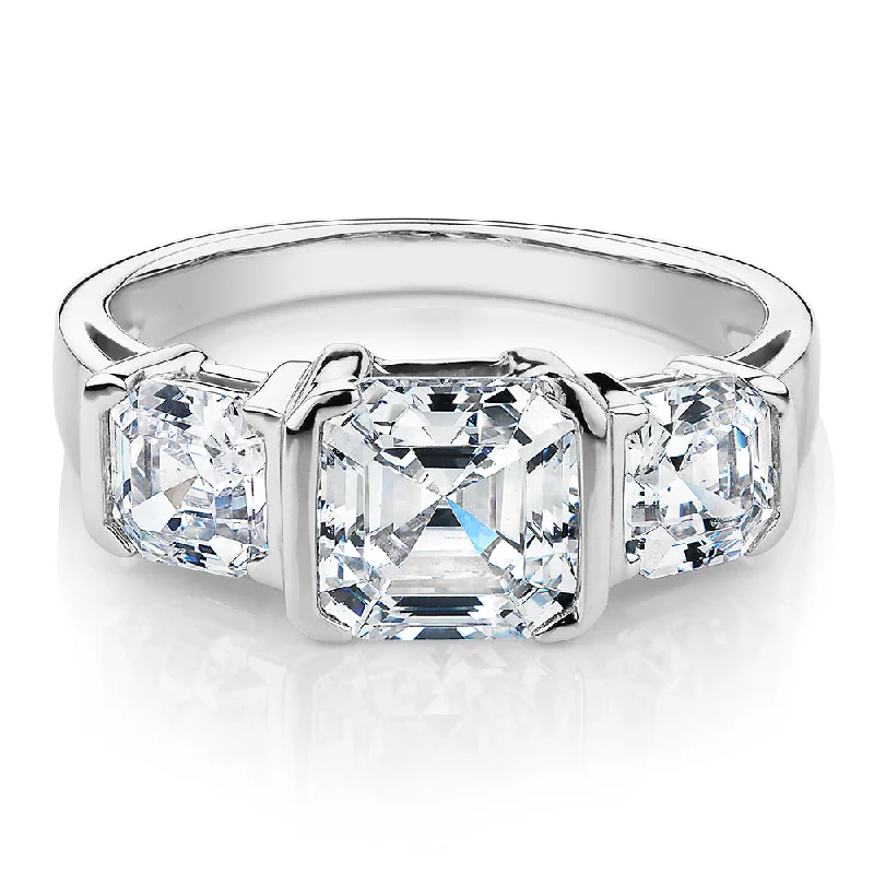 Three stone ring with 3.38 carats* of diamond simulants in 10 carat white gold