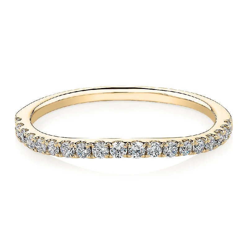 Curved wedding or eternity band with 0.25 carats* of diamond simulants in 10 carat yellow gold