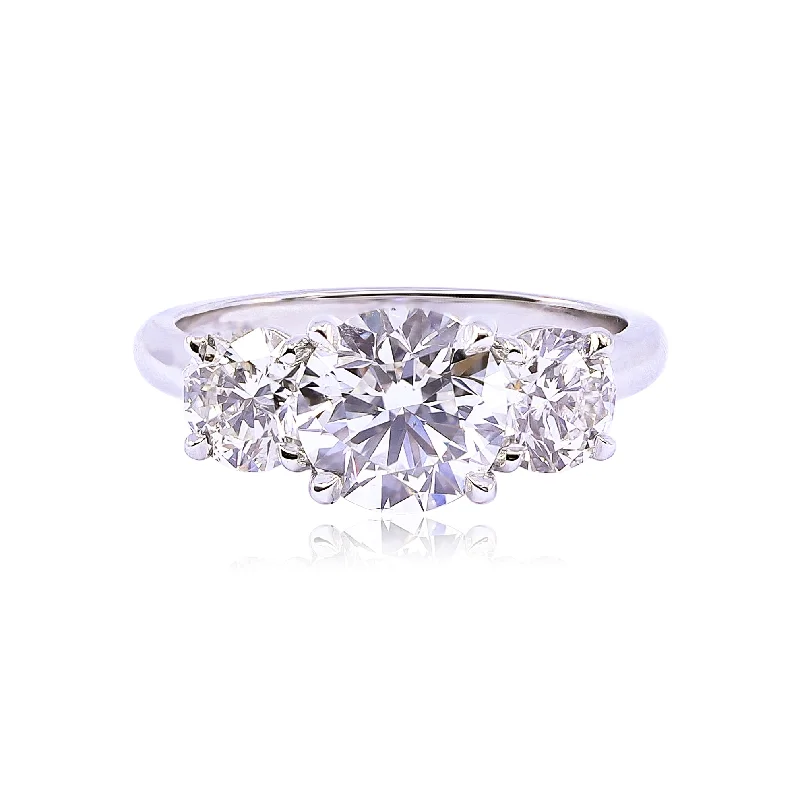 PLATINUM THREE STONE ROUND BRILLIANT DIAMOND ENGAGEMENT RING - 3.01CTW