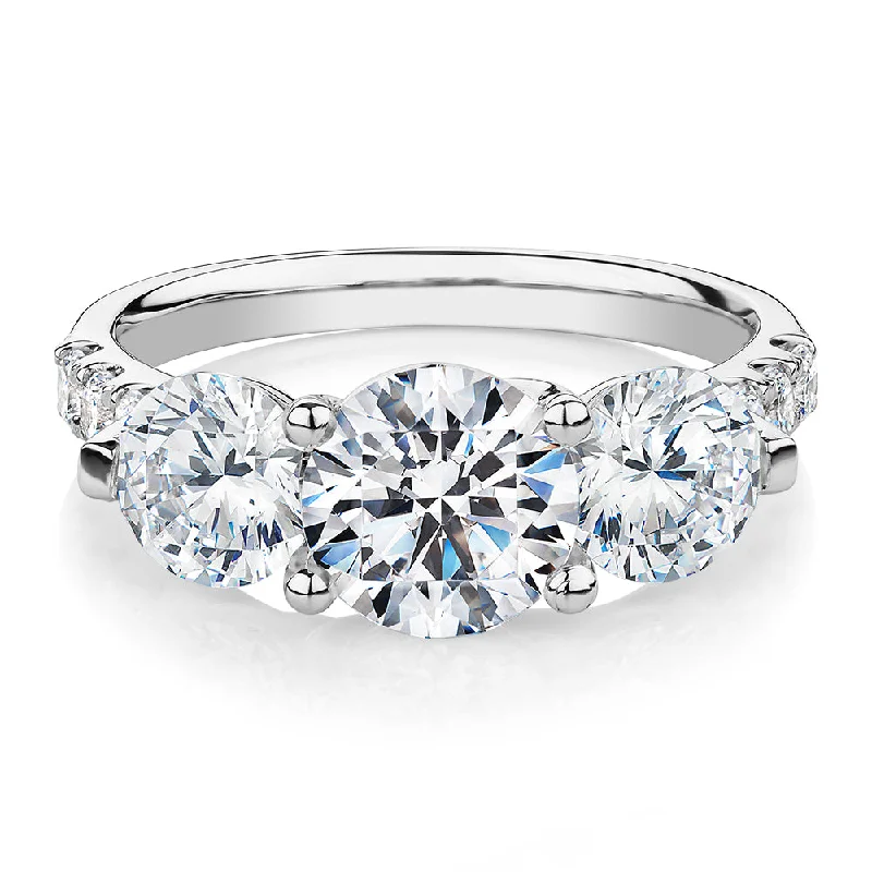 Three stone ring with 3.59 carats* of diamond simulants in 10 carat white gold