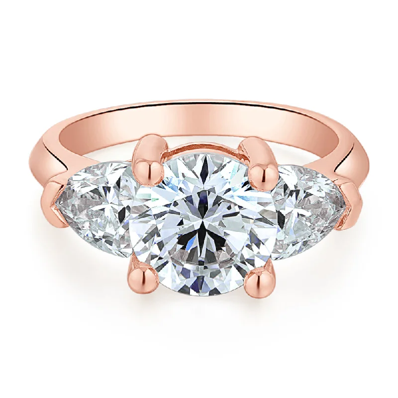 Three stone ring with 4.15 carats* of diamond simulants in 10 carat rose gold