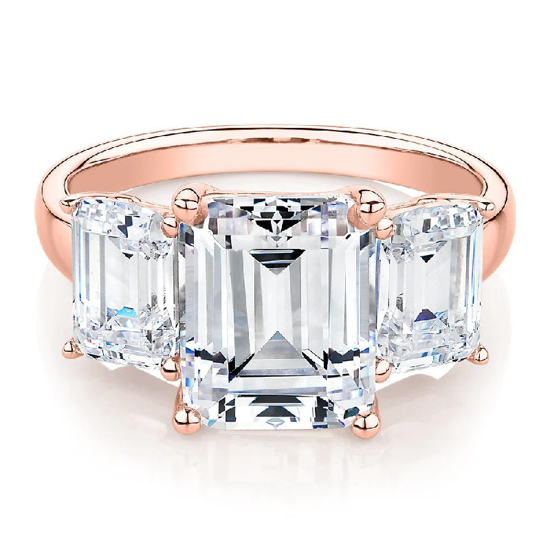 Three stone ring with 4.9 carats* of diamond simulants in 10 carat rose gold