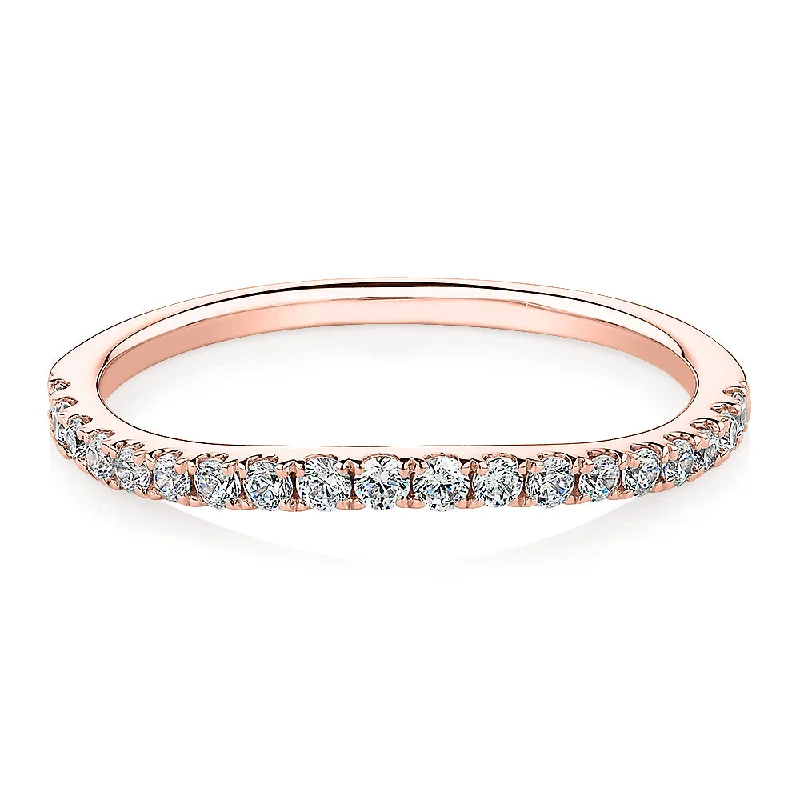 Curved wedding or eternity band with 0.25 carats* of diamond simulants in 10 carat rose gold