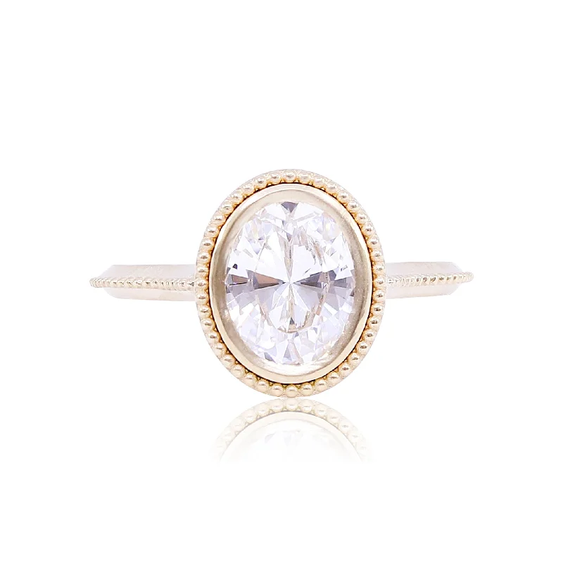 18K YELLOW GOLD OVAL SOLITAIRE ENGAGEMENT RING WITH MILGRAIN DETAIL AND SATIN FINISH (SETTING ONLY)