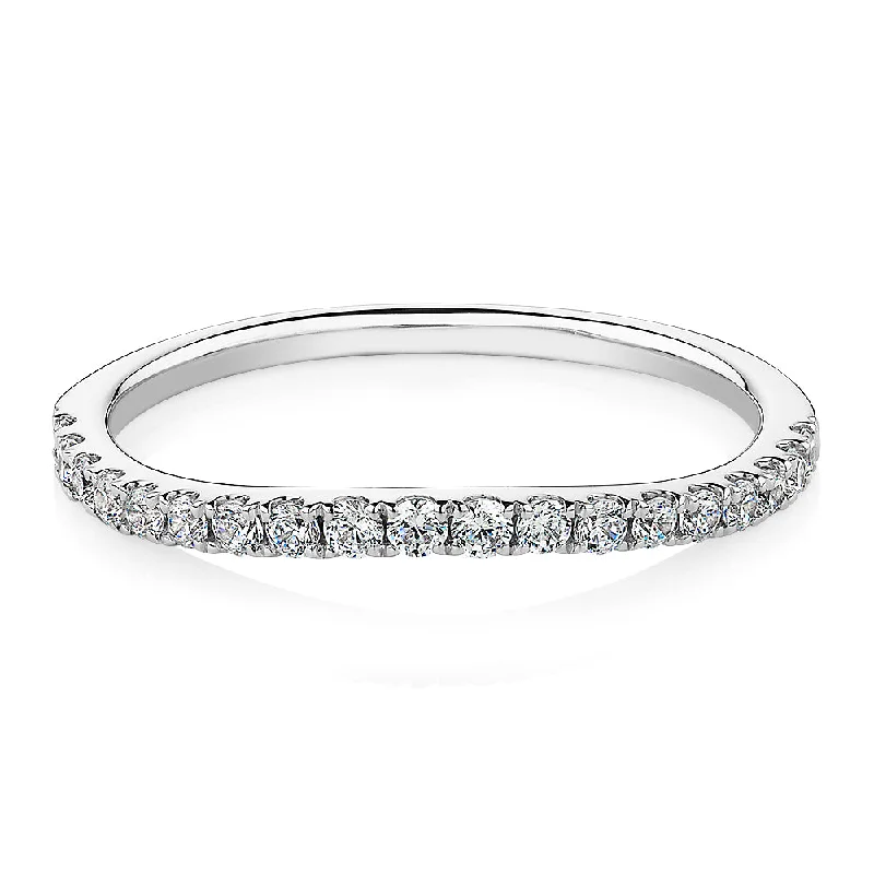 Curved wedding or eternity band with 0.25 carats* of diamond simulants in 10 carat white gold